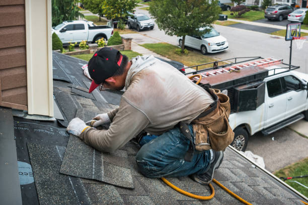 Professional Storm Damage Roof Repair technician working in Miller Place, NY